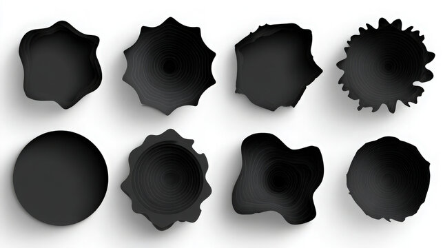 Set of eight abstract solid black ink blot shapes isolated on white background with abstract silhouette splatter