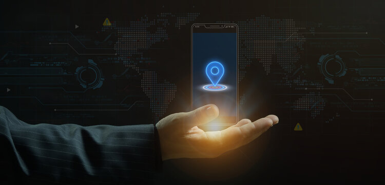 Businessman open hand supporting smartphone displaying glowing location map pin icon with world map background overlay. Global positioning system, location tracking, and mobile navigation concept.