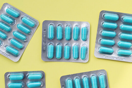 Blue capsules of Doxycycline in blister packs.