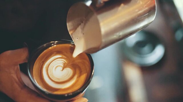 Barista Creating Latte Art in Cozy Caf&eacute;