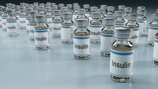 Rows of clear glass vials labeled insulin standing on a reflective surface with diabetes medication medicine