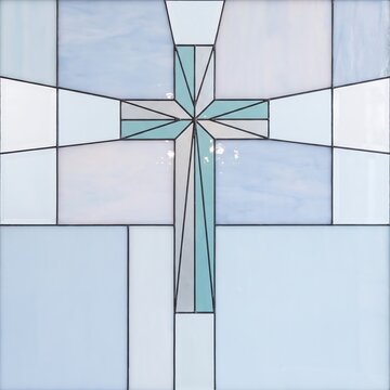Modern stained glass cross design with geometric light blue and white patterns