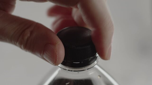 Opening bottle of soda. 24fps. Tripod shot. Original sound