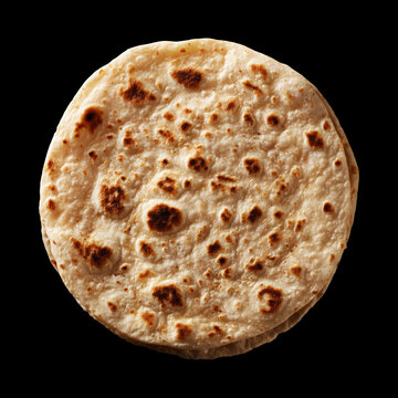 Round flatbread chapati isolated on black background with clipping path, conveying a bakery food concept with traditional appeal