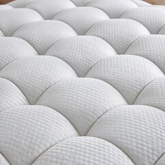 Obraz premium Close-up of a luxurious white quilted mattress surface, showcasing its comfortable and supportive texture