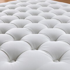 Obraz premium Close-up of luxurious white tufted upholstery, creating a soft, inviting texture for furniture and decor projects