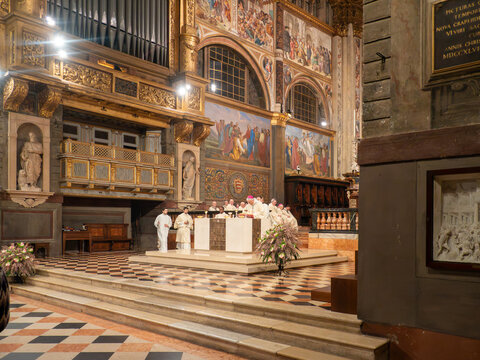 Cremona, Lombardy, Italy - 02 February 2026: View of the Blessing of Candles mass at Cremona Cathedral, featuring clergy at the altar, ornate frescoes, and the pipe organ.