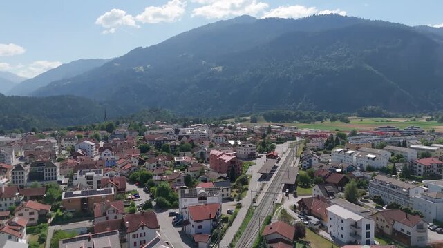 Aerial view of the village of Bonaduz in Graub&uuml;nden, Switzerland with green fields and mountains in the background.