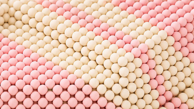 Alternating bands of shell-pink and ivory granular clusters