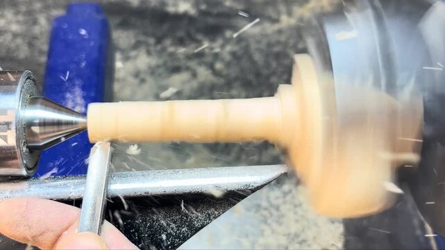 Close up of woodturning on a workshop lathe