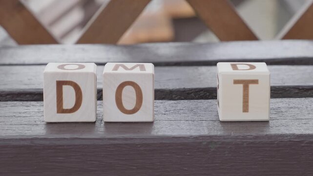 do it, motivational phrase, laying out  by hand from letters on wooden cubes, slow motion
