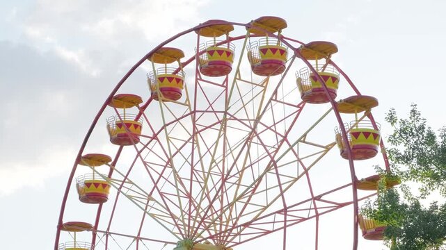ferris wheel attraction is spinning, slow motion
