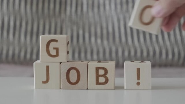good job !, motivational phrase, laying out  by hand from letters on wooden cubes, slow motion
