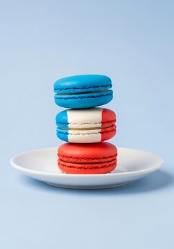 Stack of colorful macarons on a white saucer