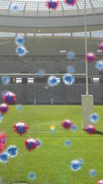 Animation of covid 19 cells over empty rugby pitch sports stadium