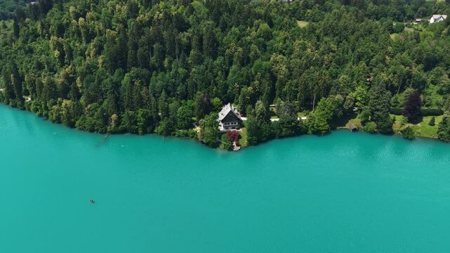 Drone Shot of Lakefront Villa and Landscape by Glacial Blue Water Color of Lake Bled, Slovenia