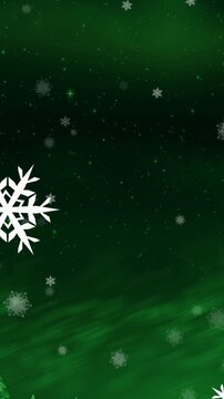 Animation of christmas snowflakes falling on green winter landscape background