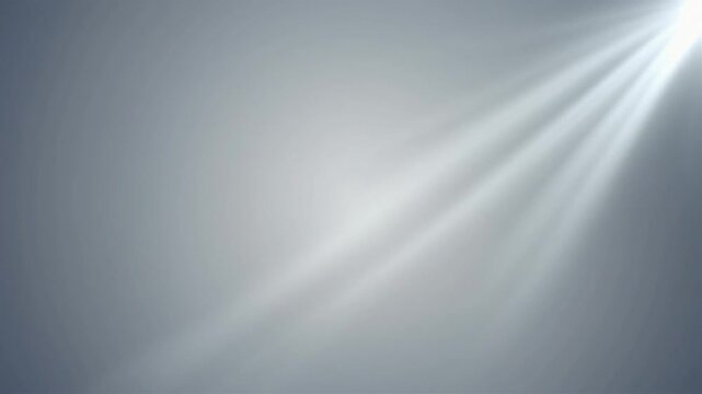 Soft light streams across a smooth, neutral gray gradient background with subtle textures.