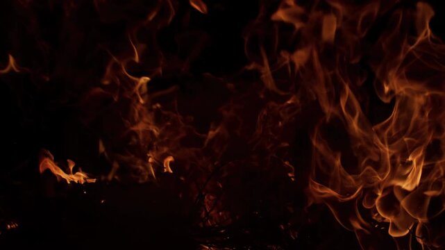 Fire blazing powerful flames. Fire burning intense motion. Fire glowing fiery atmosphere. Fire cinematic background asset.