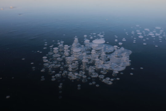 Ice ax - ice screws on winter fishing on the ice caves. Ice is very clean and beautiful. The Lake Baikal.