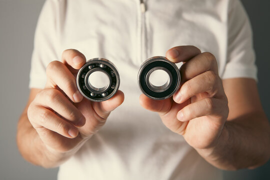 Man holding a gear. Close-up of male hands holding a gear.