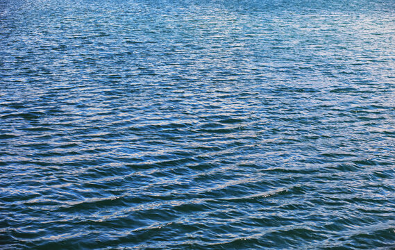 Water surface. The texture of the water. Waves on the lake in windy weather.