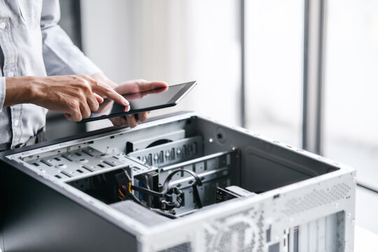 Computer repair technician specialist repairing and testing on Pc