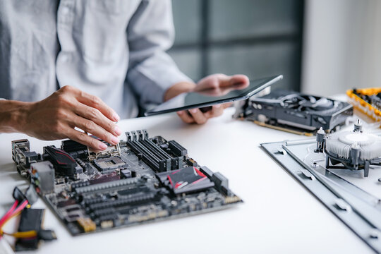 Computer repair technician specialist repairing and testing on Pc