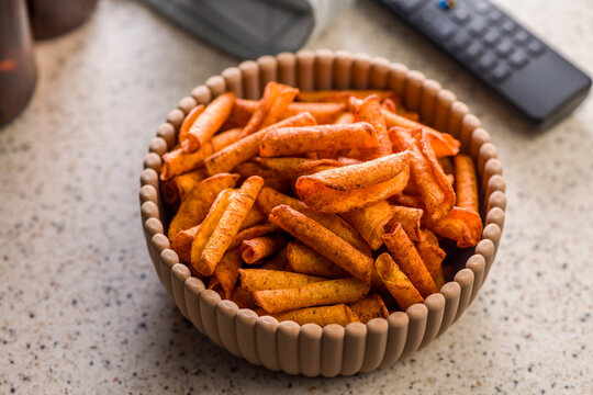 Spicy Rolled Snack Chips in a Bowl Ready for Movie Night or Casual TV Snacking