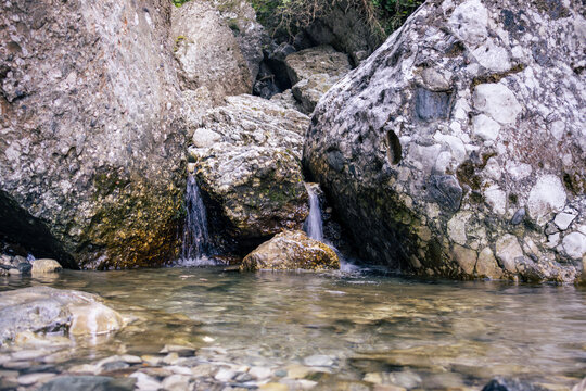 Clear Mountain Stream Flowing Through Big Rocks in Bucegi Mountains