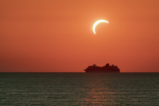A cruise ship sails near Livorno, Italy, during the solar eclipse of August 12, 2026