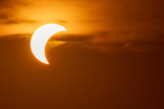 solar eclipse the moon obscures the sun sunset in the mountains