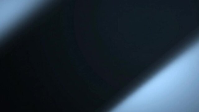 Abstract blue light leaks transitioning across dark background creating elegant motion blur in high quality cinematic video animation display now