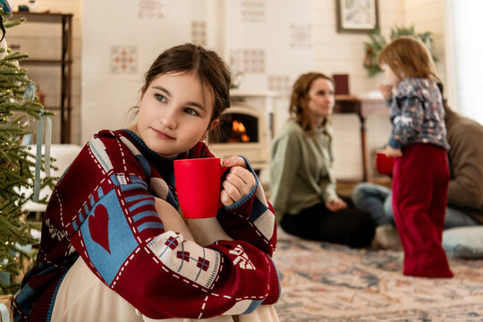 pensive girl with a mug during Christmas celebrations