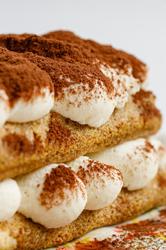 Creamy layered tiramisu dessert with cocoa powder