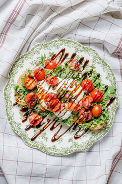 Burrata toast with tomatoes and balsamic glaze