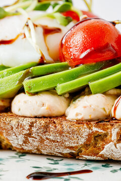 Gourmet avocado toast with tomato and poached egg