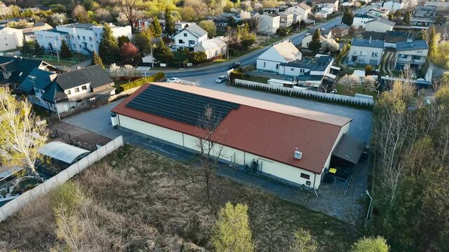 Drone view of solar panels on industrial roof