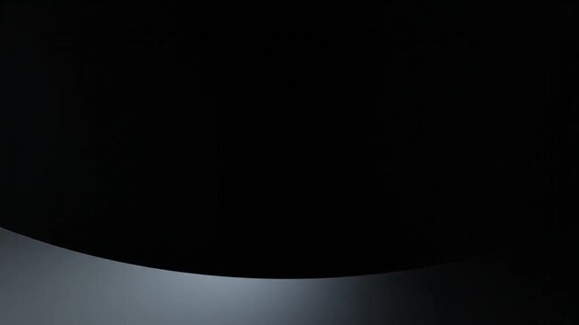 Minimalist abstract gradient transition video clip showing smooth movement of dark light gray curved shapes across the black screen surface
