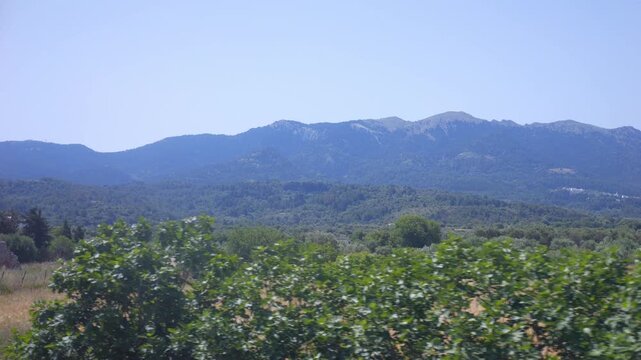 A view from a bus window traveling through the lush rural landscapes of Kos in Greece in 4K slow motion 120fps