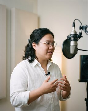 Generative AI, Man speaking with microphone during podcast or video recording