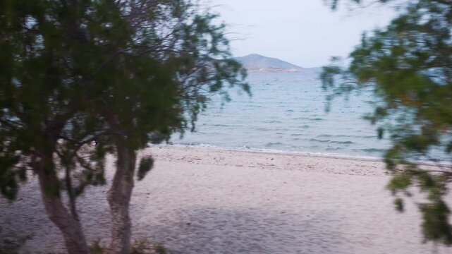A serene view of a beach and turquoise waters seen from a bus in Kos, Greece in 4K slow motion 120fps