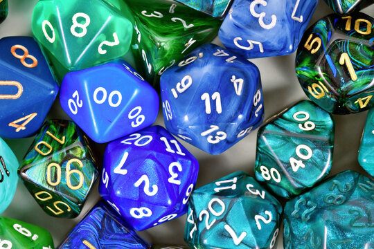 Close up of blue and green roleplaying game RPG dice