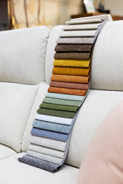 Fabric samples presenting color options on sofa