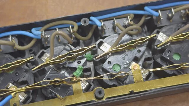 Contacts and wires inside a disassembled power strip