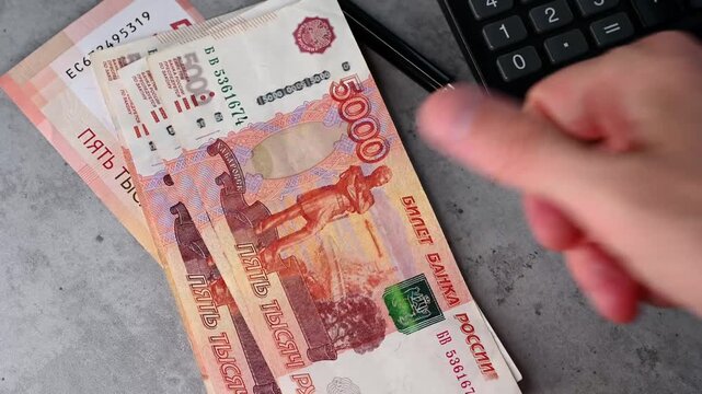 Person counting money 5000 Russian rubles in the office, conceptual video 4k resolution	