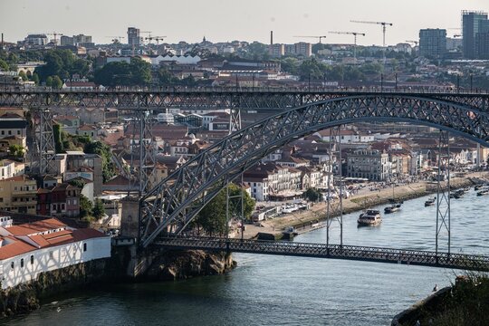 Vila Nova de Gaia, Portugal - 28 July 2026: View of Dom Luis I Bridge spanning the Douro River with historic buildings and boats in the background.