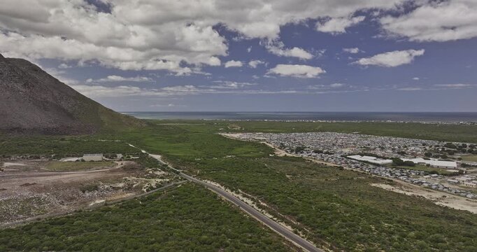 Gansbaai South Africa Aerial v19 flyover around a township landfill and surrounding vegetation beneath coastal mountains - Shot with Mavic 3 Pro Cine - Jan 8th 2024