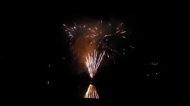 Fireworks display over Fiastra Lake during San Lorenzo night in Marche, Italy