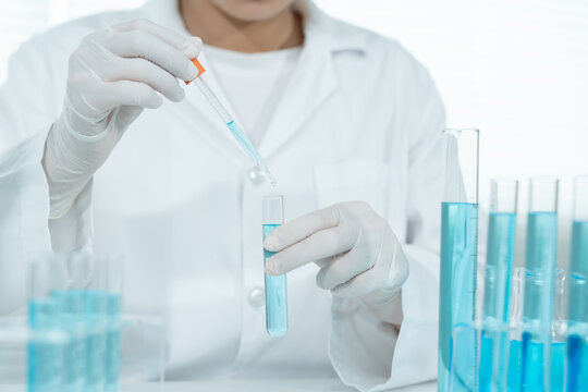 Scientist analyze biochemical samples in advanced scientific laboratory. Medical professional use dropper mix microbiological developmental of viral. Biotechnology research in  science lab. cosmetic